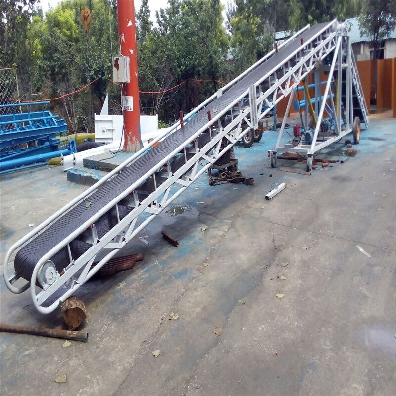 卸車用正反轉(zhuǎn)運(yùn)輸機(jī)直銷 可轉(zhuǎn)彎平板式紙箱裝車皮帶機(jī)